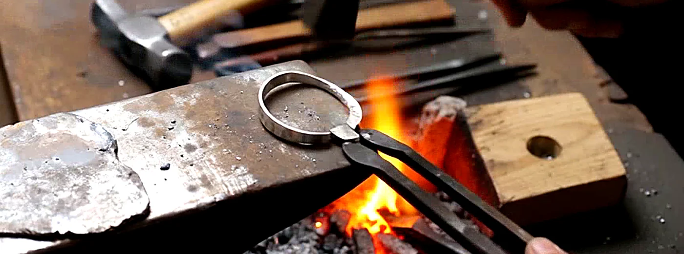 A Valkara silversmith at work in Celuk, Bali
